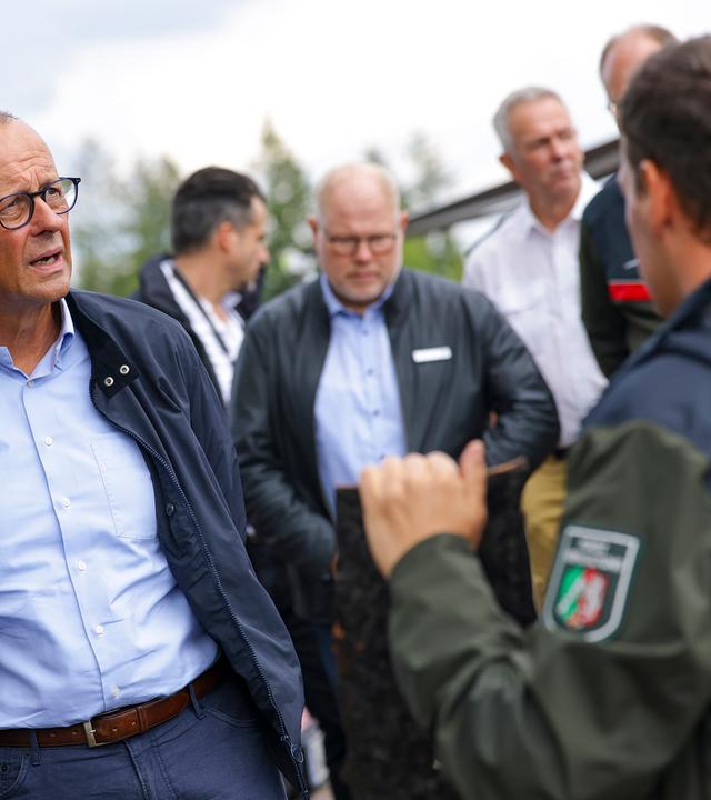 German Chancellor Friedrich Merz visits Huertgenwald following wildfires near Dueren, Germany, 22 August 2026. The wildfire in Huertgenwald, one of the largest forest fires in North Rhine-Westphalias history, burned around 300 hectares of forest before being brought under control on August 20.