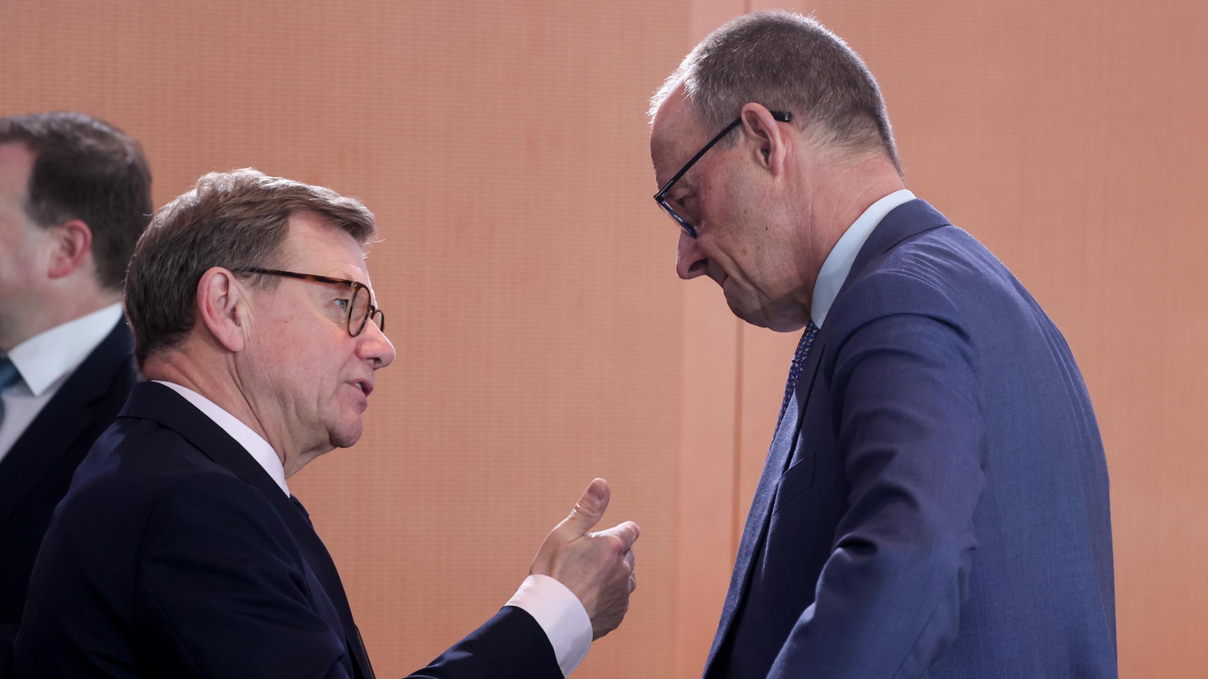 German Foreign Minister Johann Wadephul (L) talks with German Chancellor Friedrich Merz during the weekly cabinet meeting of the German government in Berlin, Germany, 01 April 2026.