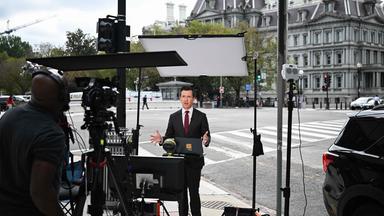 MS NOW White House Correspondent Vaughn Hillyard works on a street corner near the White House in Washington, DC, on September 21, 2026. Three leading US news outlets announced on September 21 they will go to court after being banned from the White House, as President Donald Trump claimed that media critical of his administration is a "Cancer" threatening national security. CNN, MS NOW and Politico said in a joint statement that they were filing suit after Trump last week ordered them to be barred from the presidential complex.