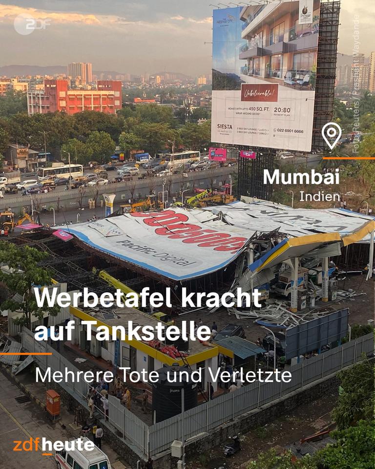 Eine Werbetafel ist auf eine Tankstelle in Mumbai gekracht