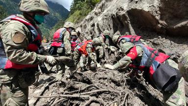 Rescuers from the Chinese People s Liberation Army work in a mudslide-hit area near Gyirong Port in Gyirong County, in Xigaze, southwest China s Xizang Autonomous Region, on August 28, 2026. The death toll had risen to five and 558 remained missing as of 3 p.m. on Friday after a mudslide struck the Gyirong Port along the China-Nepal border in southwest China s Xizang Autonomous Region, according to the region s emergency management department. Rescuers are operating around the clock in mudslide-affected areas near the Gyirong Port.Rescuers from the Chinese People s Liberation Army work in a mudslide-hit area near Gyirong Port in Gyirong County, in Xigaze, southwest China s Xizang Autonomous Region, on August 28, 2026. The death toll had risen to five and 558 remained missing as of 3 p.m. on Friday after a mudslide struck the Gyirong Port along the China-Nepal border in southwest China s Xizang Autonomous Region, according to the region s emergency management department. Rescuers are operating around the clock in mudslide-affected areas near the Gyirong Port.