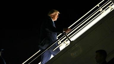 US President Donald Trump boards Air Force One at Central Nebraska Regional Airport in Grand Island, Nebraska, on October 5, 2026. (Photo by Kent NISHIMURA / AFP)
