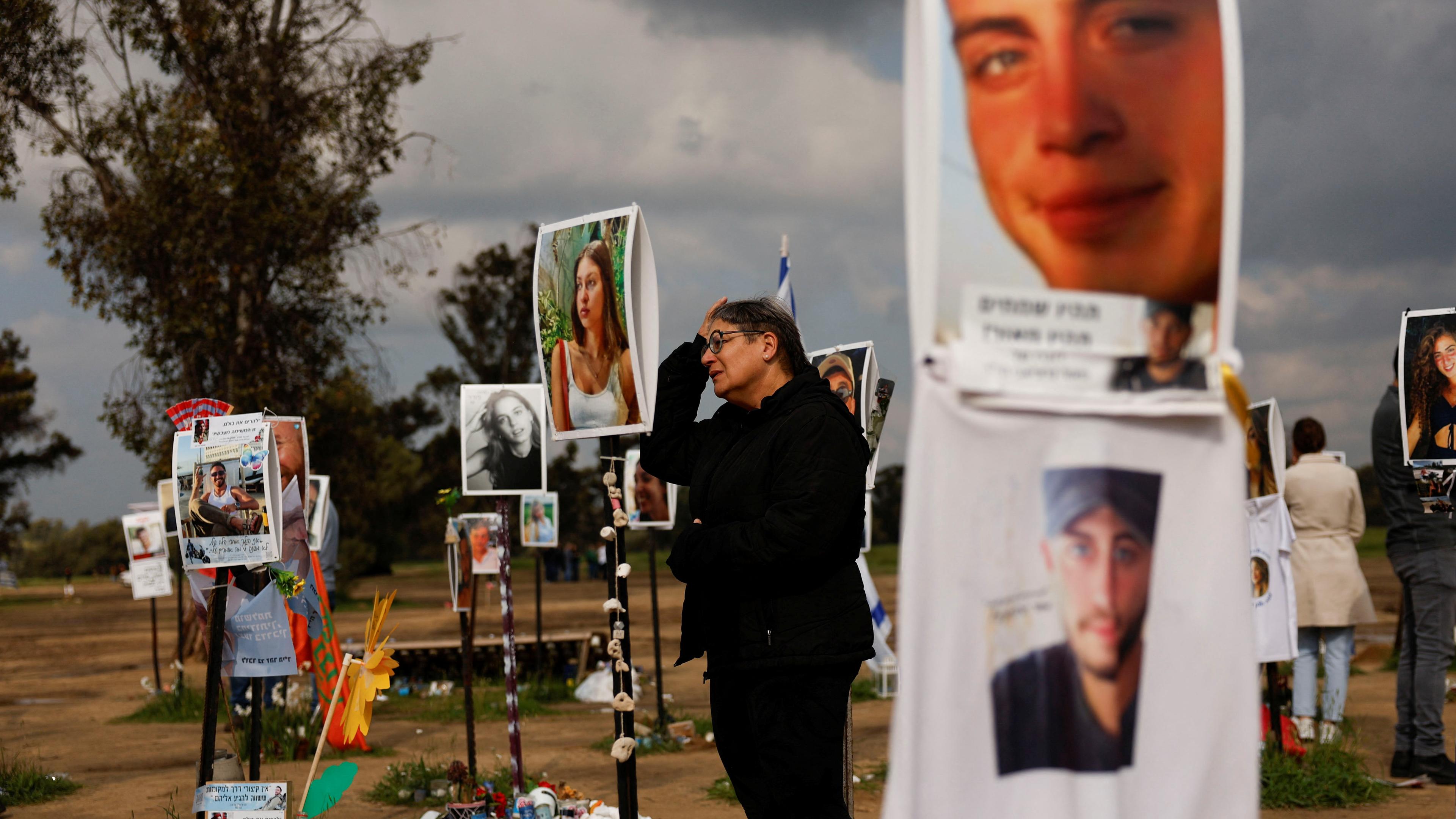 A woman reacts as she visits the site of the Nova festival, in Reim