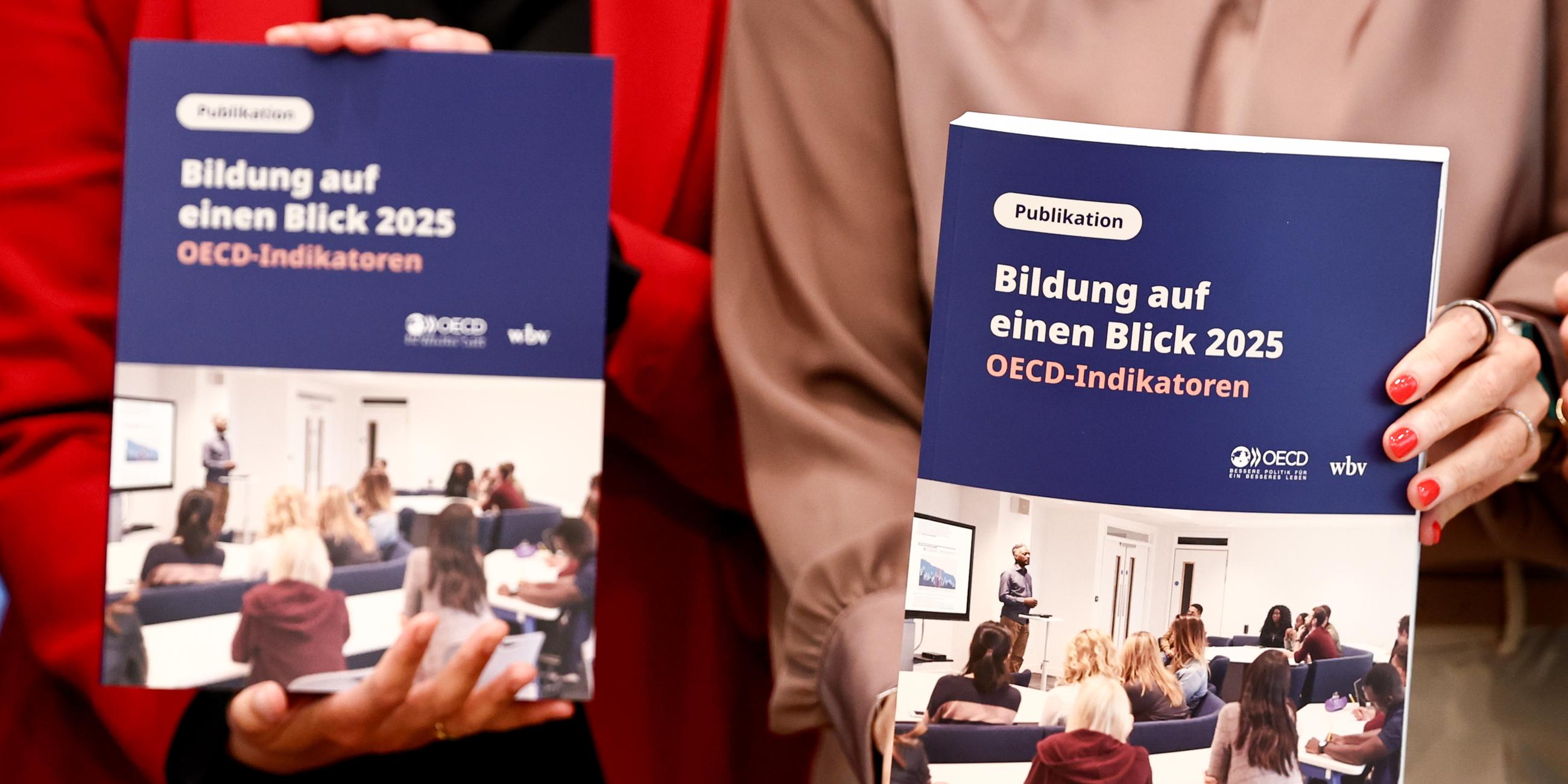 German Minister of Research, Technology and Space Dorothee Baer (R) and Parliamentary State Secretary to the Federal Minister of Education, Family Affairs, Senior Citizens, Women and Youth Mareike Wulf (L) attend a presentation of the Organisation for Economic Co-operation and Development (OECD) Study Education