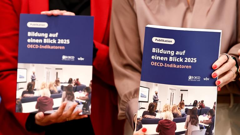 German Minister of Research, Technology and Space Dorothee Baer (R) and Parliamentary State Secretary to the Federal Minister of Education, Family Affairs, Senior Citizens, Women and Youth Mareike Wulf (L) attend a presentation of the Organisation for Economic Co-operation and Development (OECD) Study Education