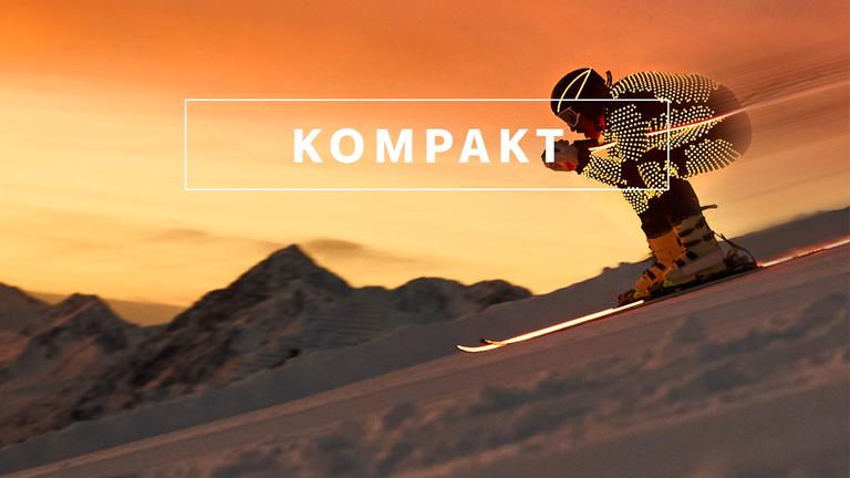 Das Wintersport "KOMPAKT"- Logo vor Bergkulisse mit einem Alpin-Skifahrer