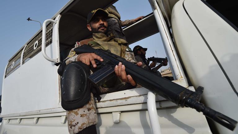 Pakistani security officials stand guard at Karachi Port