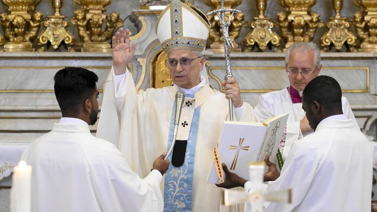 Pope Leo XIV arrives at the St. Thomas of Villanova Church to celebrate a mass, in Castel Gandolfo, on the outskirts of Rome.