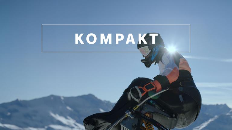 Wintersport "KOMPAKT"- Logo vor Paralympics-Athlet