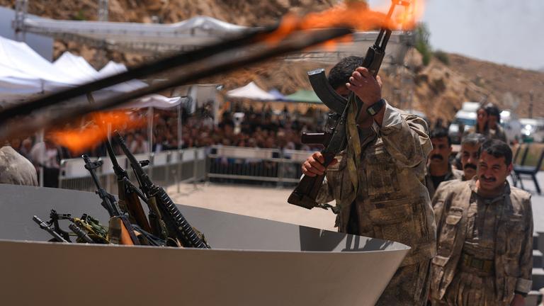 The first group of PKK terrorists, (listed as a terrorist organization by Turkiye, the U.S. and the EU), lays down and destroys their weapons in Sulaymaniyah