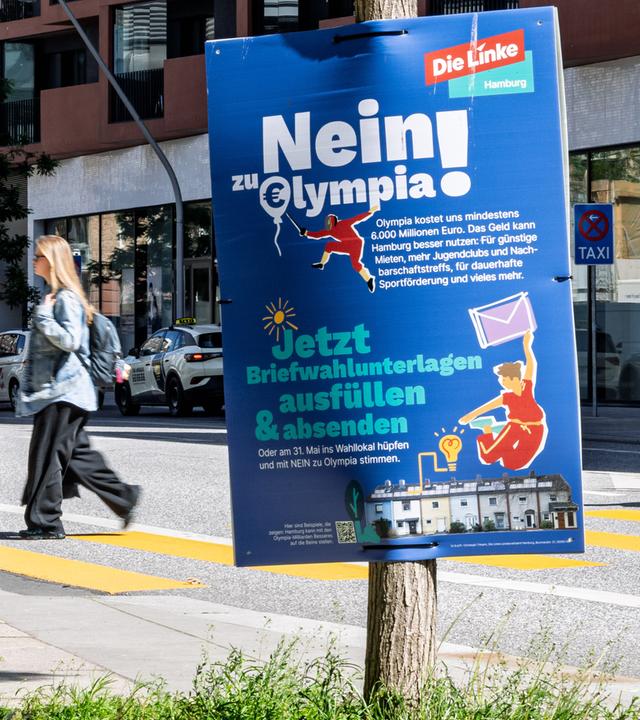 Zwei Plakate werben mit gegensätzlichen Positionen zur Olympia-Bewerbung, darunter "Ja zu Hamburg und Olympia" (SPD) und "Nein! zu Olympia" (Die Linke) am 28.05.2026 in Hamburg.