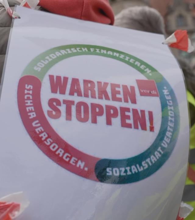 Protestschild gegen die Gestzesreform bei einer Demonstration