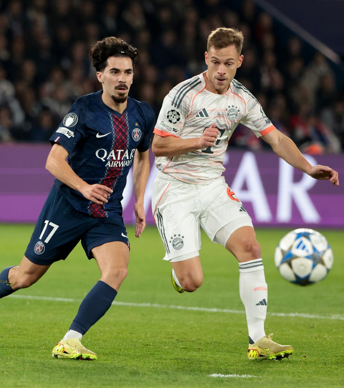 Im Duell: Paris-Spieler Vitinha und Bayerns Mittelfeld-Stratege Joshua Kimmich