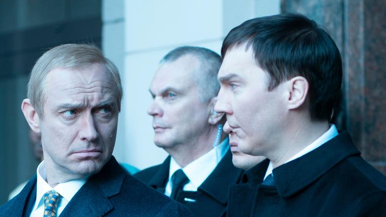 This image shows Jude Law, as Vladimir Putin, left, and Paul Dano, as Vadim Baranov.