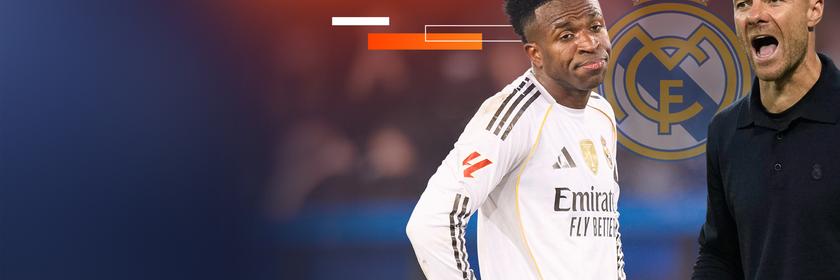 Trainer Xabi Alonso ruft etwas, ein Spieler von Real Madrid schaut skeptisch. Im Hintergrund das Logo von Real Madrid.