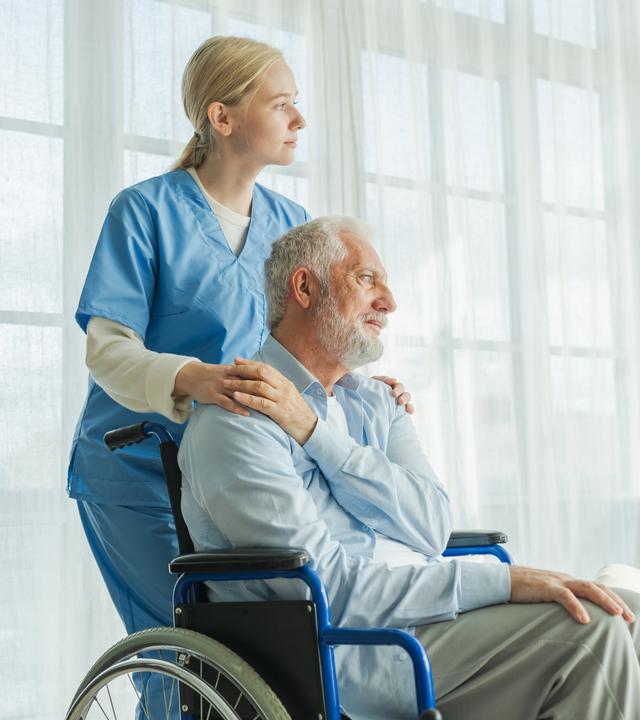 Help support retirement healthcare. Nurse helping old man in wheelchair. Patient and woman in nursing home for medical caregiver, Nurse taking care of paralyzed man in chair for people with disability