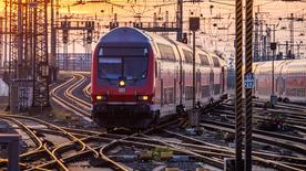 A regional train arrives at Frankfurt am Main main station at sunset on November 10, 2021.