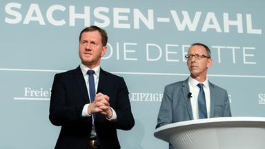 CDU-Politiker und Sachsens Ministerpräsident Kretschmer und AfD-Poltiker Jörg Urban bei einer Podiumsdiskussion zur Landtagswahl am 21.08.2019 in Dresden.