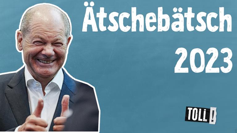 Bundeskanzler Olaf Scholz zeigt beide Daumen hoch und lacht in die Kamera; Text: Ätschebätsch 2023