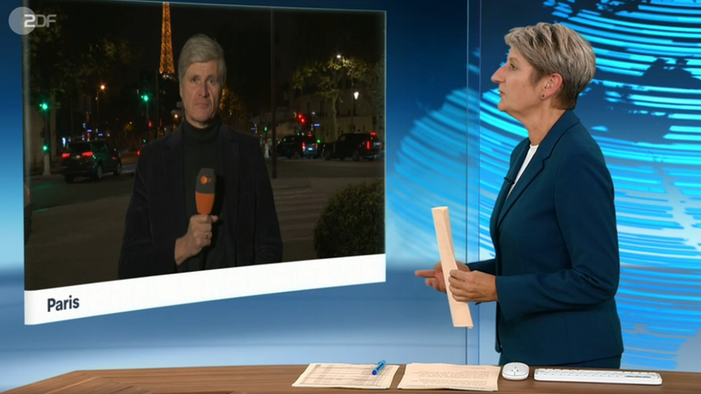 Schaltgespräch zwischen Moderatorin Anne Gellinek und dem Korrespondenten Walde in Paris