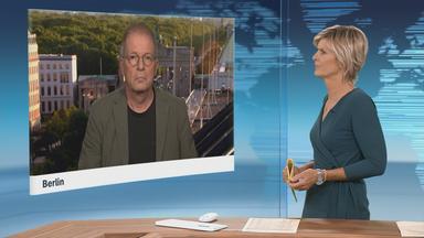 Schaltgespräch mit Klaus Brodbeck und Moderation.