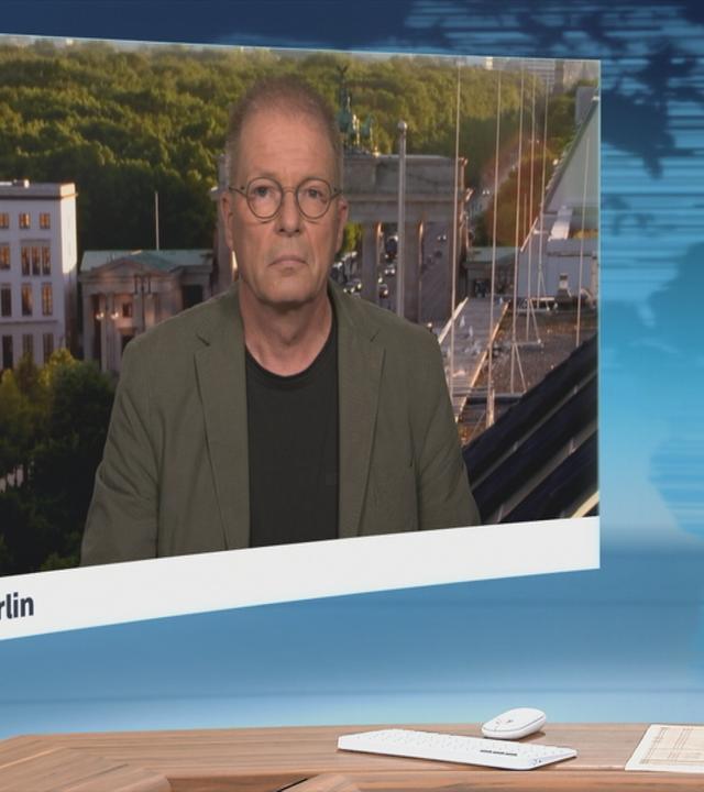 Schaltgespräch mit Klaus Brodbeck und Moderation.
