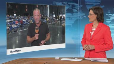 Moderatorin im Schaltgespräch mit ZDF-Reporter Martin Niessen