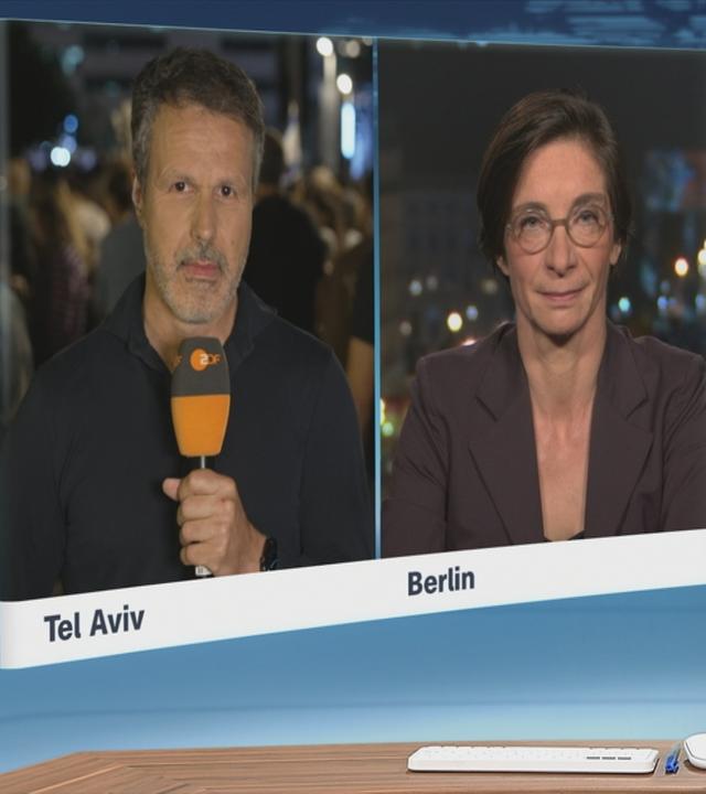 Die ZDF-Korrespondent*innen Thomas Reichart und Diana Zimmermann bei einem Schaltgespräch.