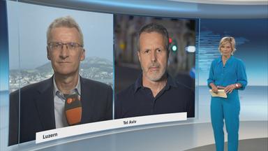 Die ZDF-Korrespondenten Elmar Theveßen und Thomas Reichart 