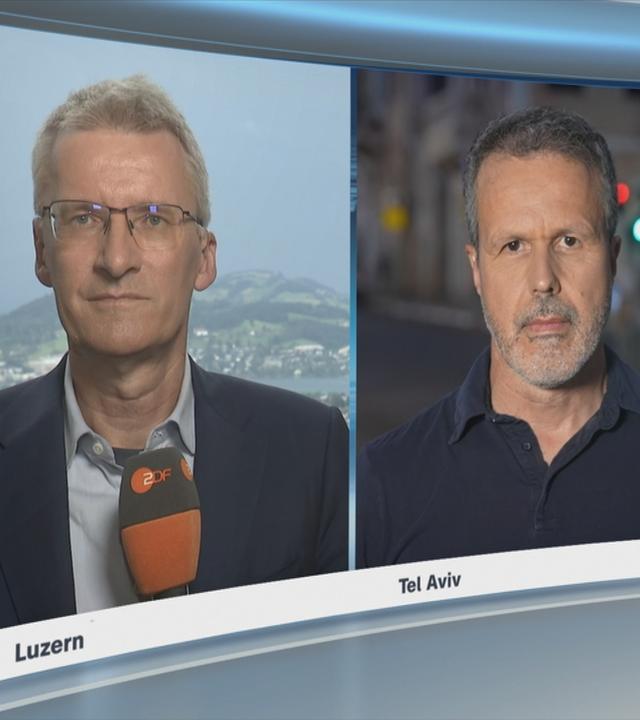 Die ZDF-Korrespondenten Elmar Theveßen und Thomas Reichart 