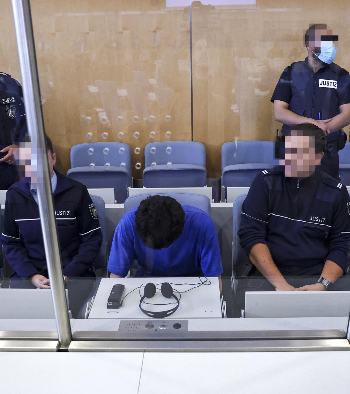 Defendant Issa Al H. (C) attends the start of his trial over the Solingen city festival knife attack, at the Higher Regional Court, in Duesseldorf, Germany, 27 May 2025.