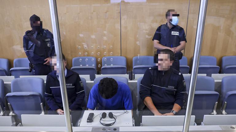 Defendant Issa Al H. (C) attends the start of his trial over the Solingen city festival knife attack, at the Higher Regional Court, in Duesseldorf, Germany, 27 May 2025.