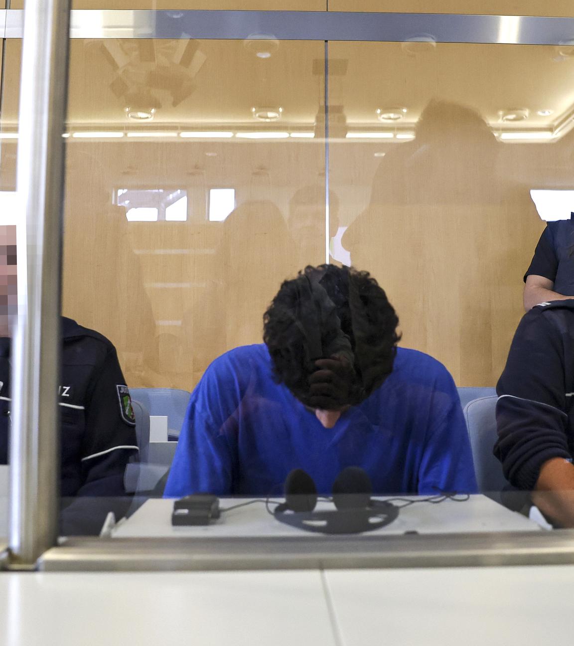 Defendant Issa Al H. (C) attends the start of his trial over the Solingen city festival knife attack, at the Higher Regional Court, in Duesseldorf, Germany, 27 May 2025.