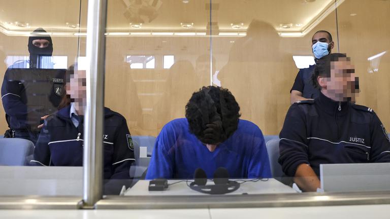 Defendant Issa Al H. (C) attends the start of his trial over the Solingen city festival knife attack, at the Higher Regional Court, in Duesseldorf, Germany, 27 May 2025.