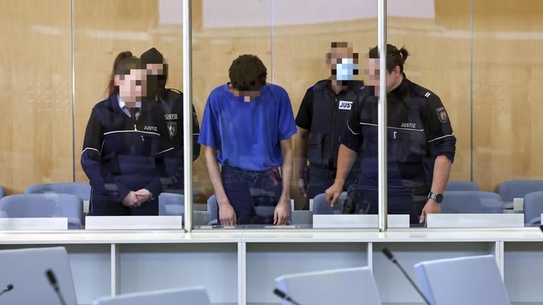 Defendant Issa Al H. (C) attends the start of his trial over the Solingen city festival knife attack, at the Higher Regional Court, in Duesseldorf, Germany, 27 May 2025.