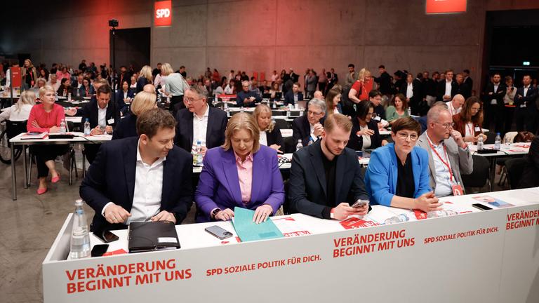 Chairman of the Germany's Social Democratic Party (SPD) and Vice-Chancellor Lars Klingbeil, the designated SPD co-leader, German Minister for Labour and Social Affairs Baerbel Bas designated Secretary General of Germany's Social Democratic Party (SPD) Tim Kluessendorf and outgoing SPD co-leader Saskia Eskens sit at the begining of the German Social Democratic Party (SPD) Party Congress at the City Cube in Berlin.