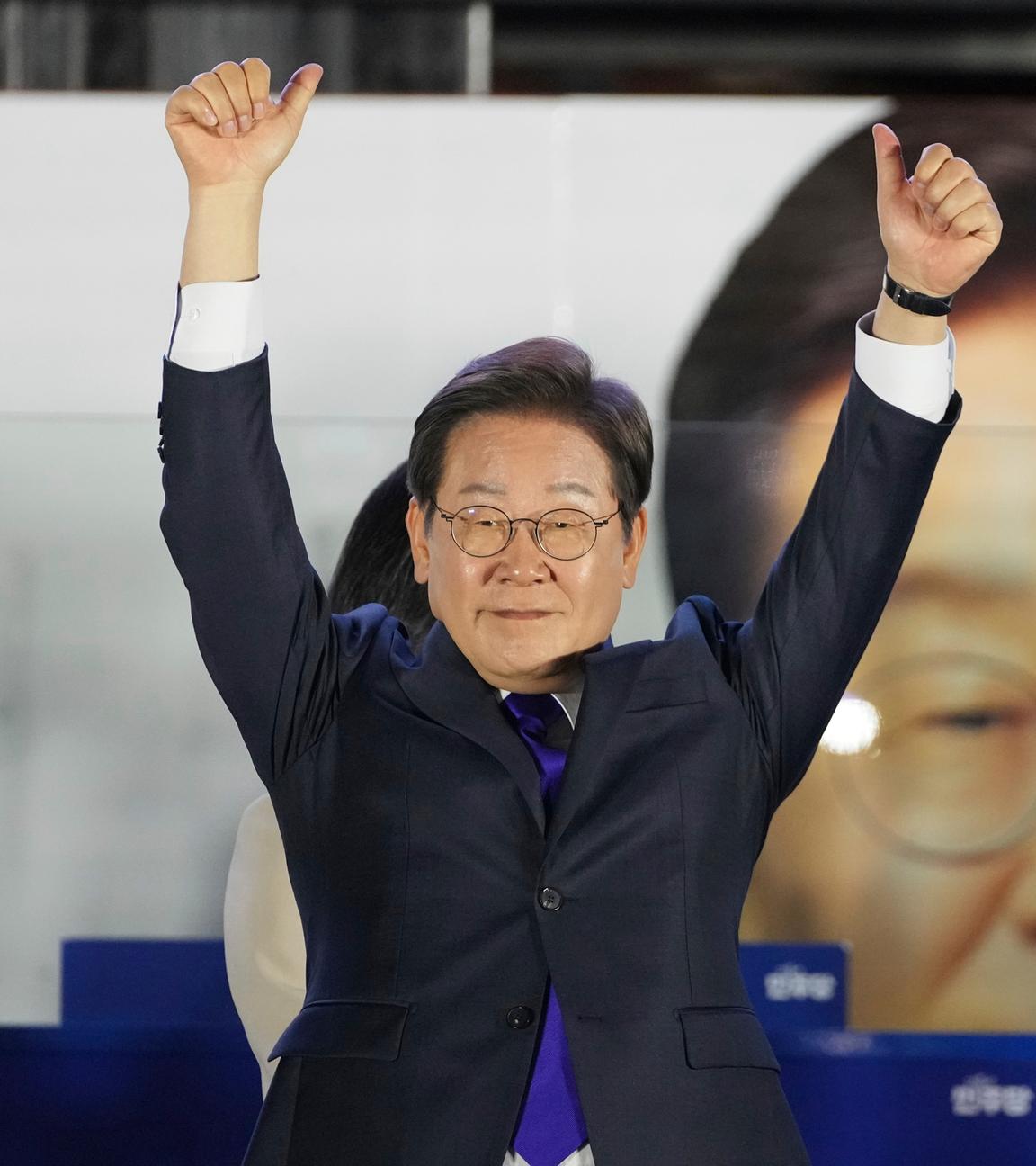 South Korea's Democratic Party's presidential candidate Lee Jae-myung, gestures as his supporters gather outside of the National Assembly in Seoul, South Korea, Wednesday, June 4, 2025.