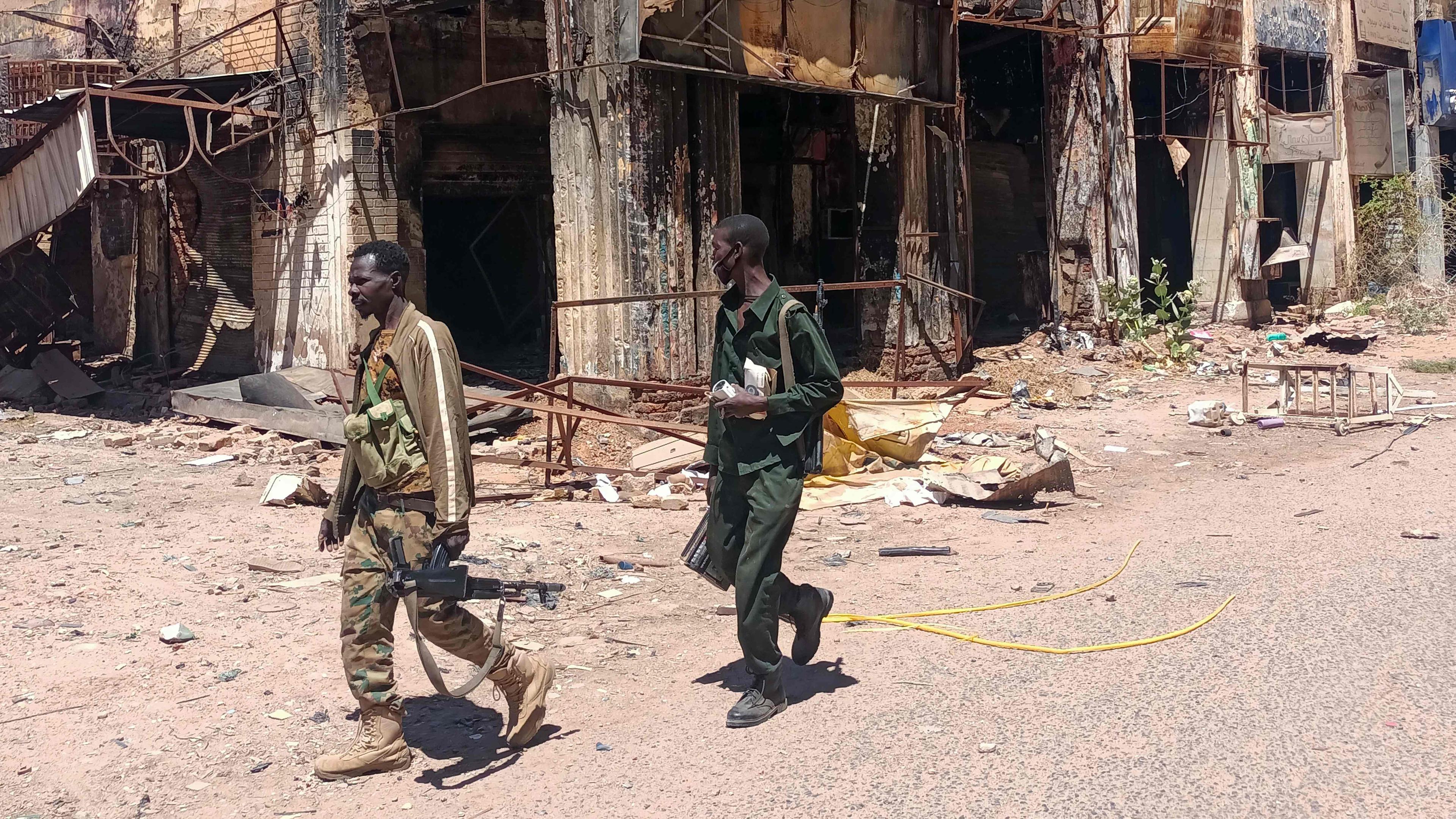 Fighters loyal to the army patrol a market area in Khartoum on March 24, 2025. 