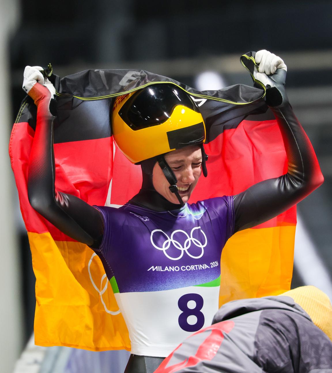 Die deutsche Skeletonfahrerrin Susanne Kreher jubelt nach ihrem Lauf bei den Olympischen Winterspielen 2026 in Cortina 