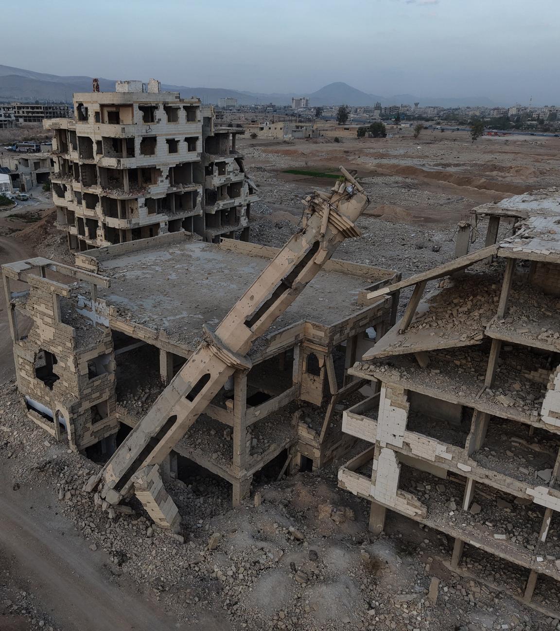Mehrere Häuser des Stadtviertels Cobar in Damaskus, Syrien liegt in Trümmern.