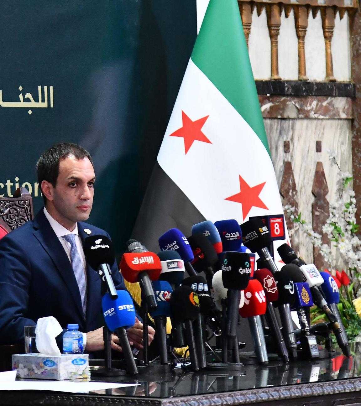 Nawar Najmeh, spokesperson for Syria's Higher Committee for People's Assembly Elections, speaks during a press conference