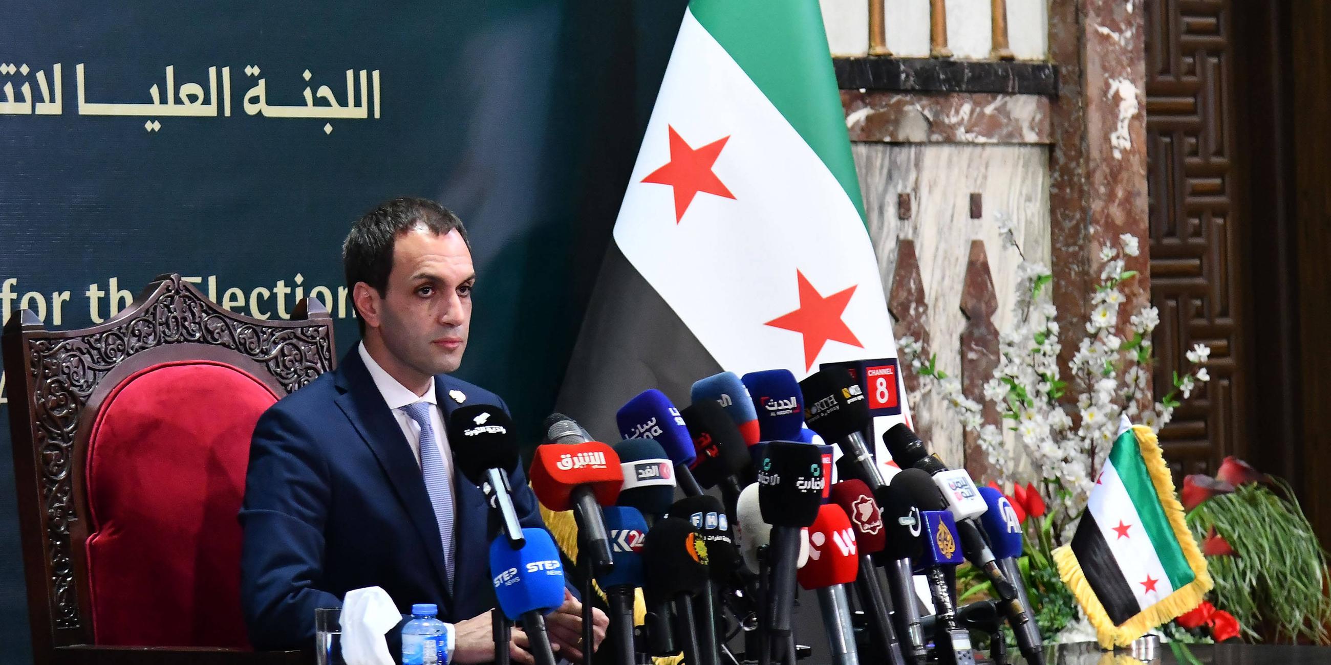 Nawar Najmeh, spokesperson for Syria's Higher Committee for People's Assembly Elections, speaks during a press conference