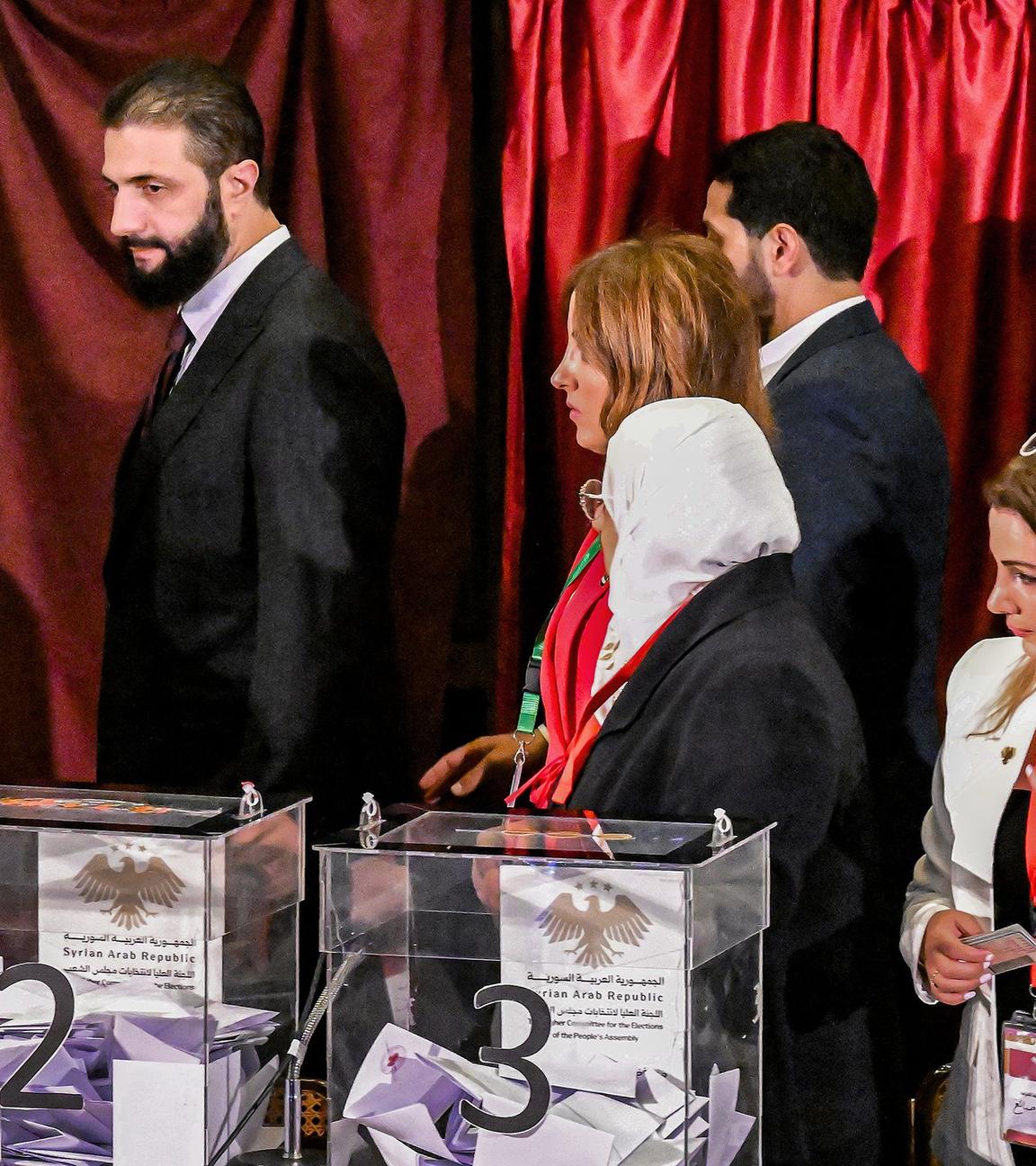 Syria's interim President Ahmed al-Sharaa visits a polling station where members of Syrian local committees have been casting their votes in the country's selection process to designate an interim parliament.