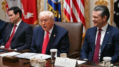 US President Donald Trump (C), flanked by Secretary of State Marco Rubio (L) and Secretary of Defense Pete Hegseth (R), speaks during a Cabinet Meeting in the Cabinet Room of the White House in Washington