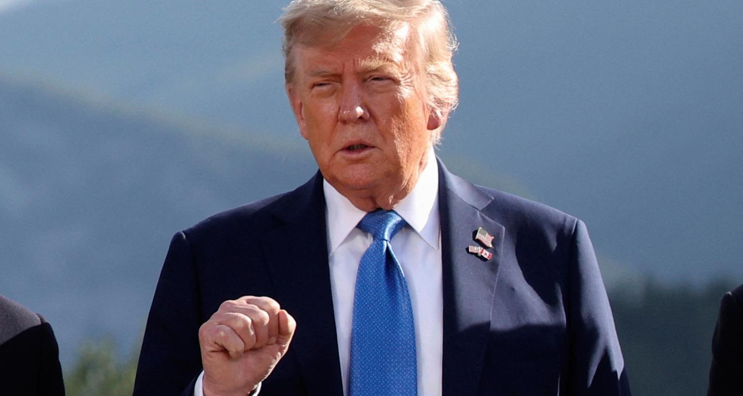 U.S. President Donald Trump gestures as he attends a family photo session during the G7 Summit, in Kananaskis, Alberta, Monday, June 16, 2025. 