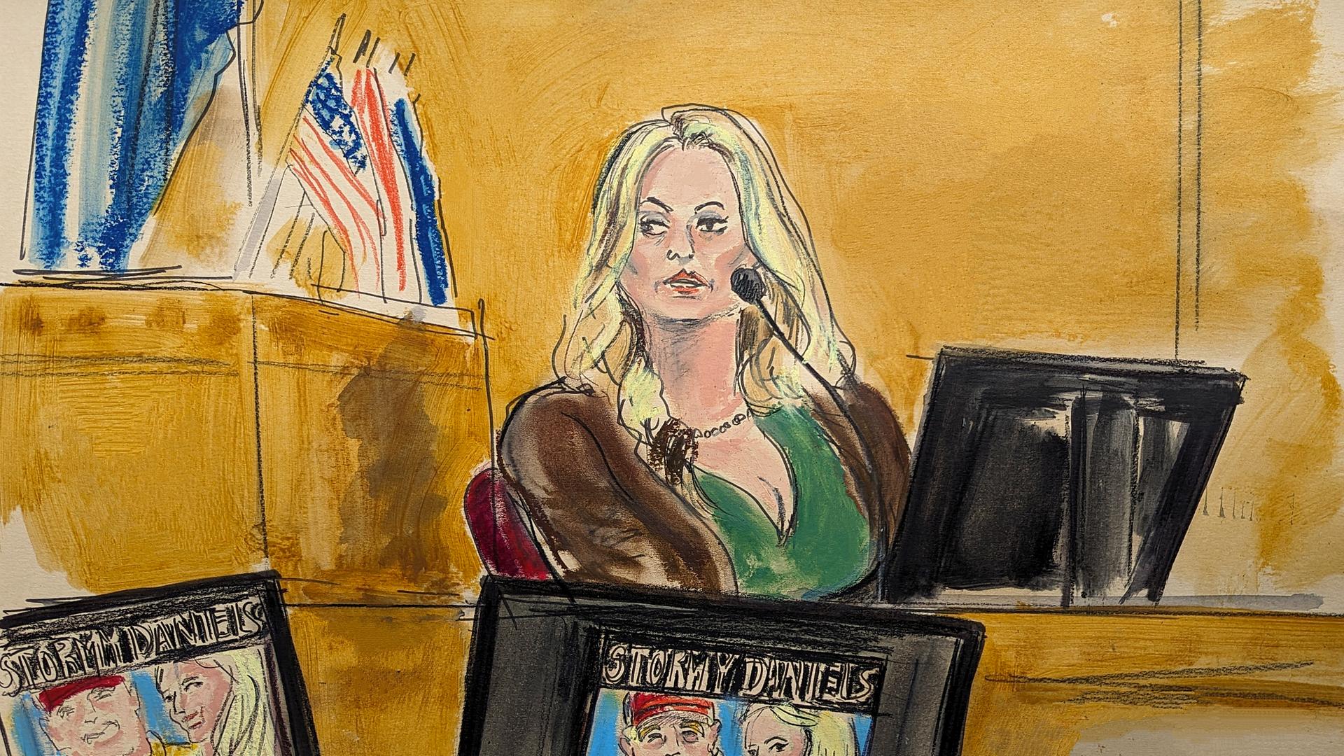 09.05.2024, USA, New York: Auf dieser Gerichtszeichnung sagt Stormy Daniels im Zeugenstand aus, während ein Werbebild für eine ihrer Shows, das ein Bild von Trump zeigt, auf Monitoren in einem Strafgericht in Manhattan angezeigt wird.