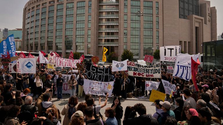 People gather to protest outside Caglayan courthouse, in Istanbul, Turkey.
