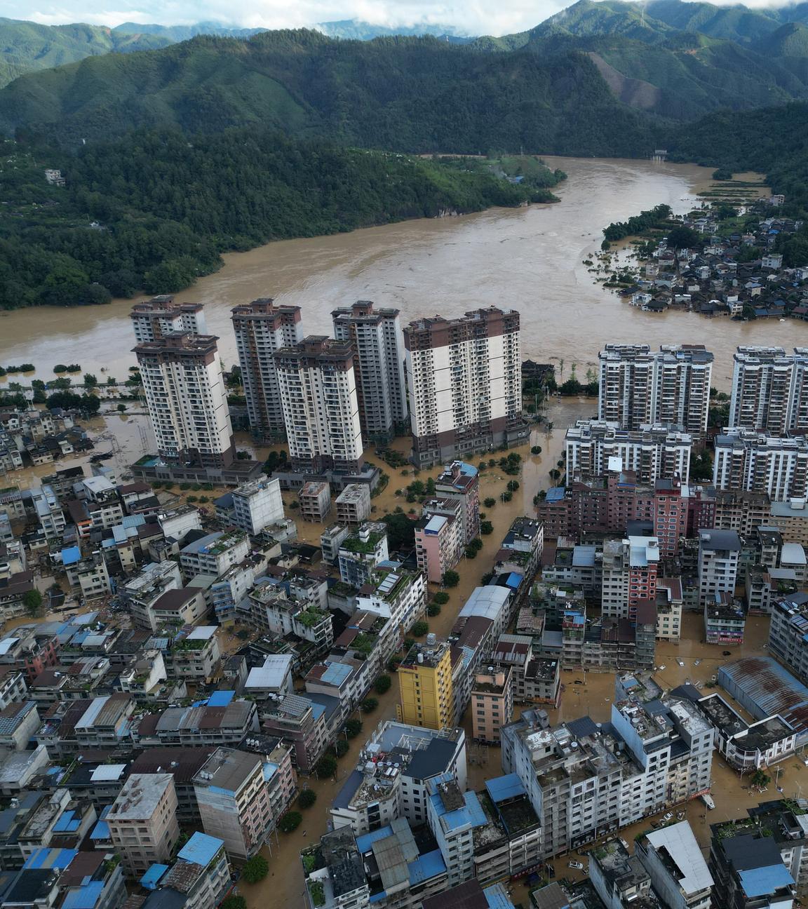 An aerial drone photo shows the flood-stricken Rongjiang County, southwest China s Guizhou Province, June 28, 2025. 