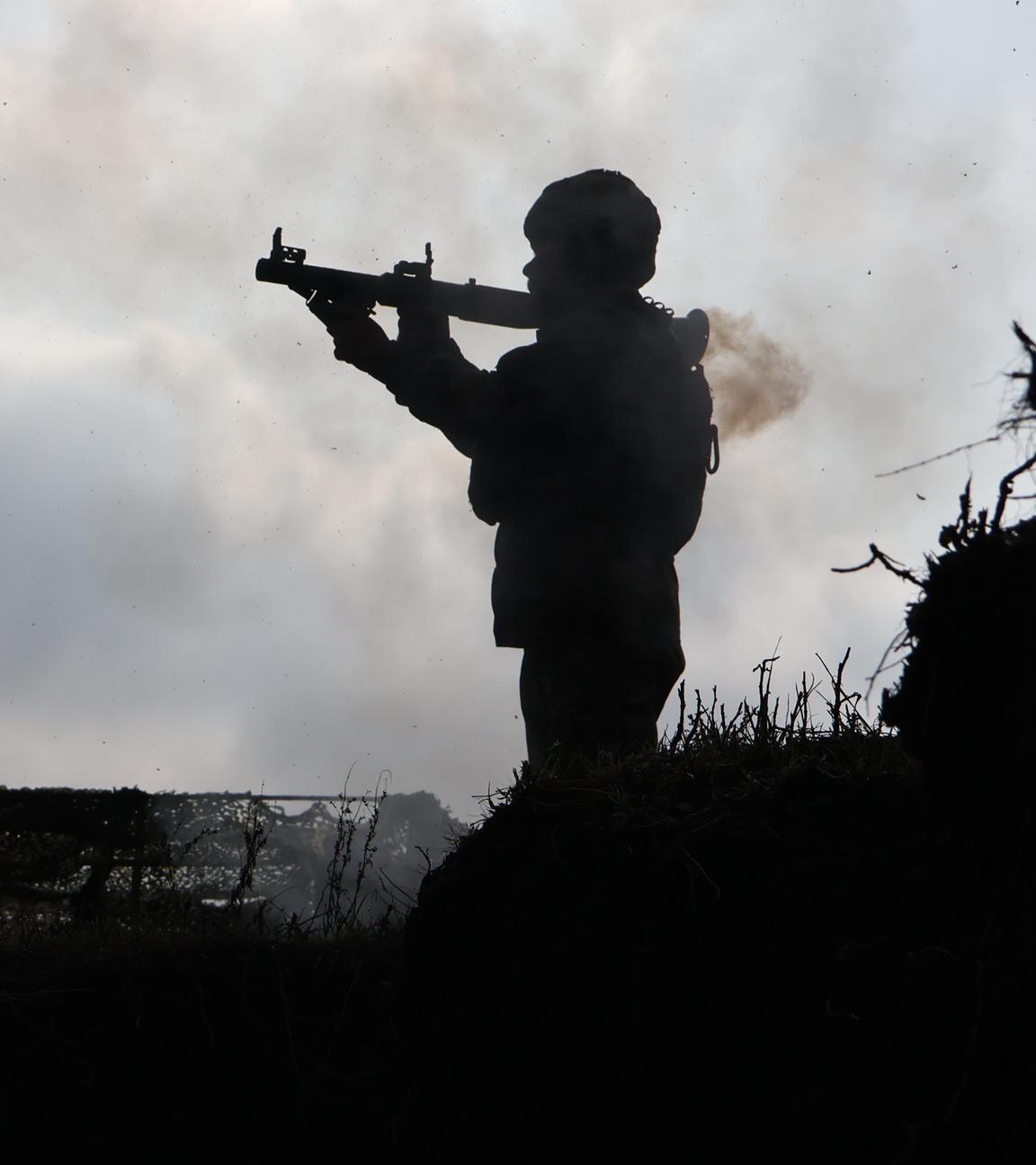 a soldier fires from a RPG-7 during training at the polygon