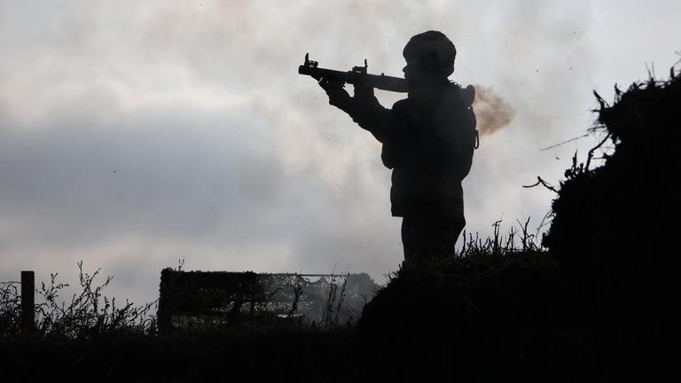 a soldier fires from a RPG-7 during training at the polygon